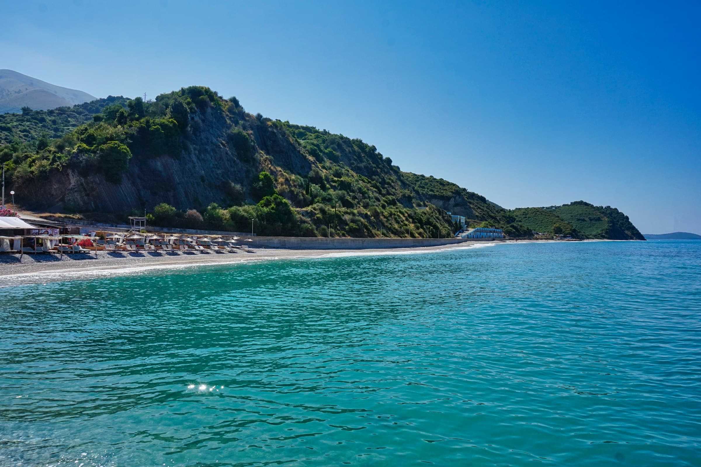 A bay on the Albanian coast with clear turquoise water